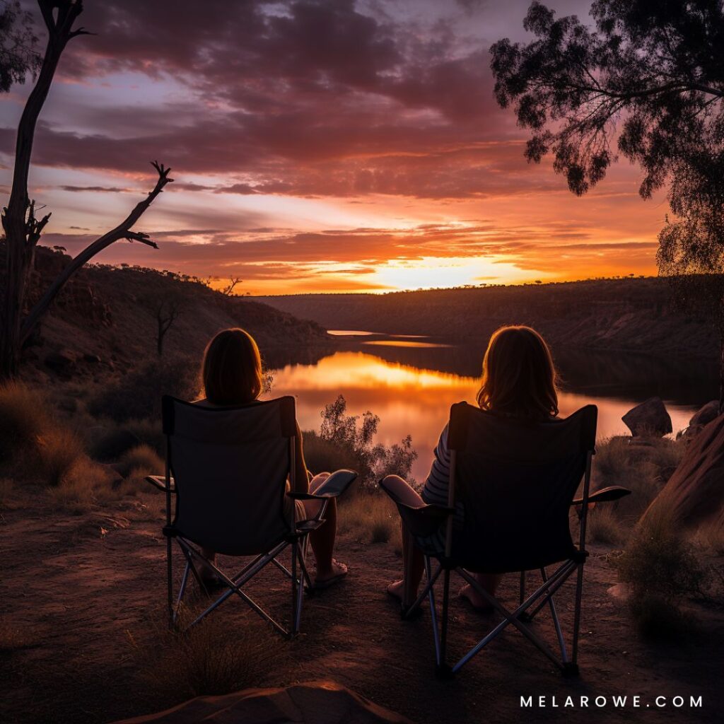 Image of two women enjoying their huevos ranchero cooked in a skillet on a campfire in the outback on sunrise
